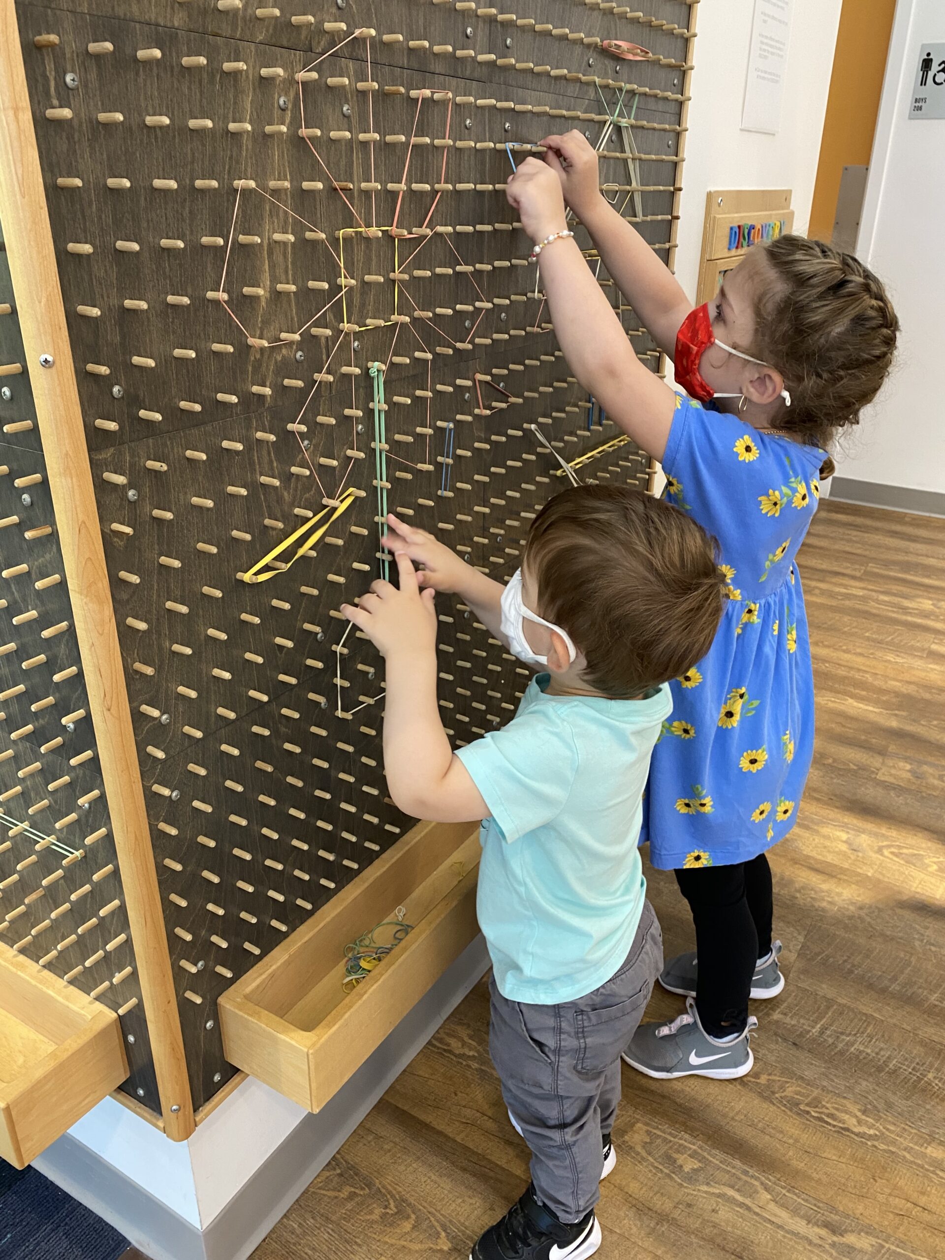 Making shapes with rubber bands.